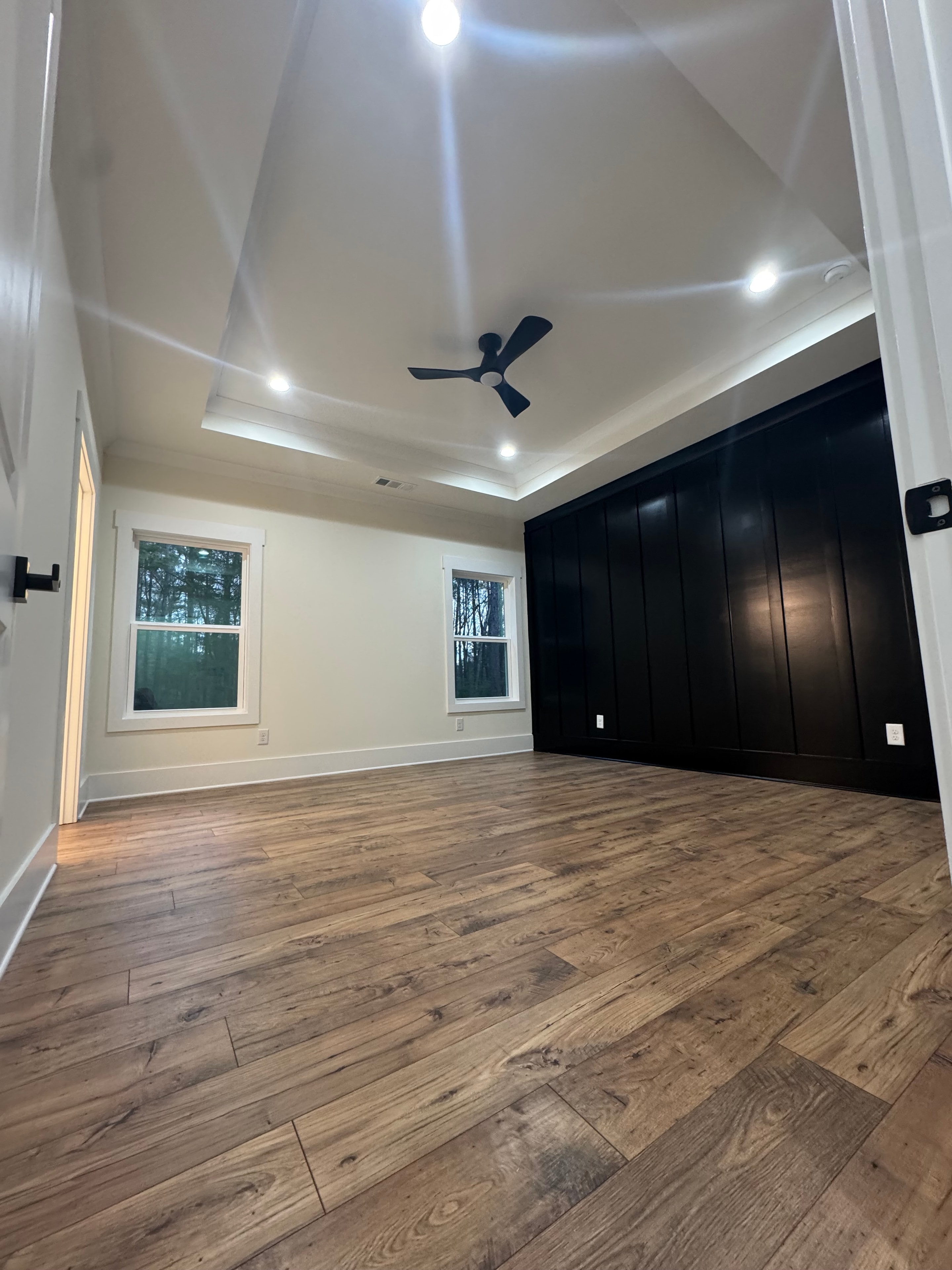 Interior room with black painted ceiling and white walls