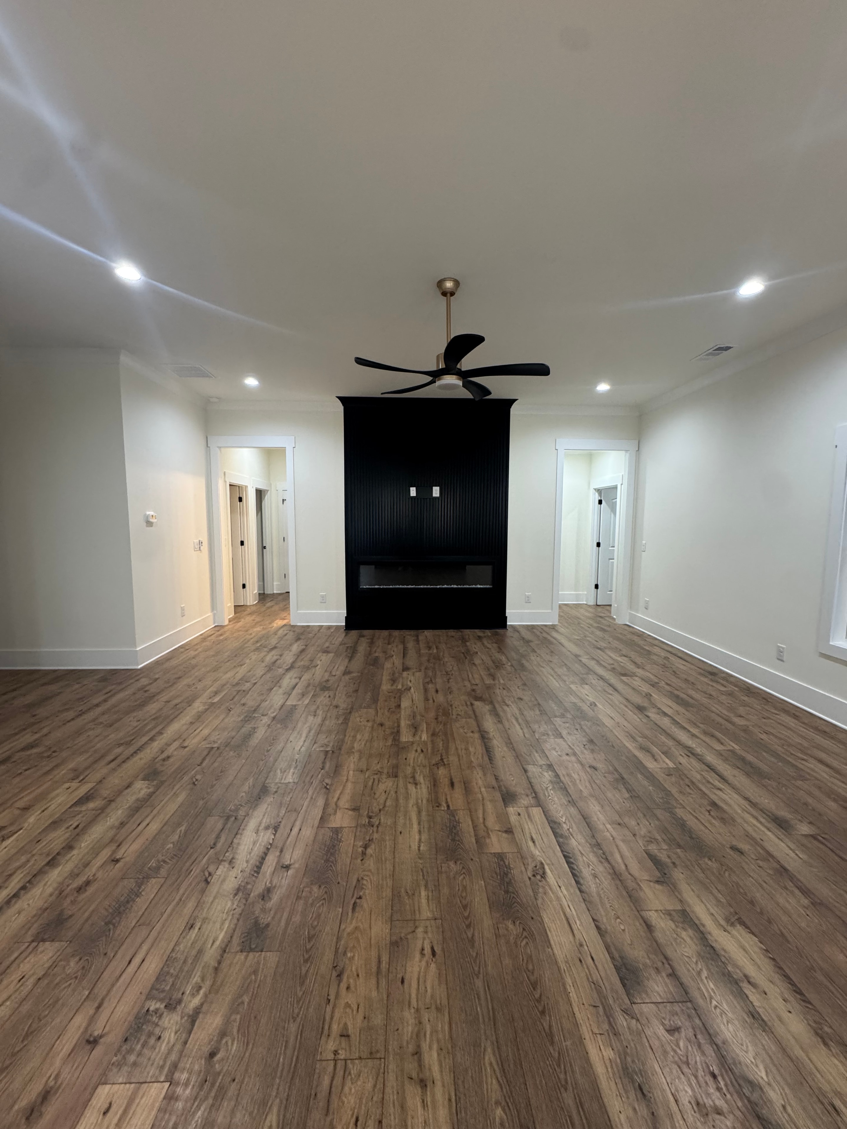 Interior room with white walls and wood accent wall